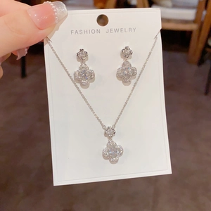 Sparkling silver four-leaf flower jewelry set with zircon necklace and stud earrings