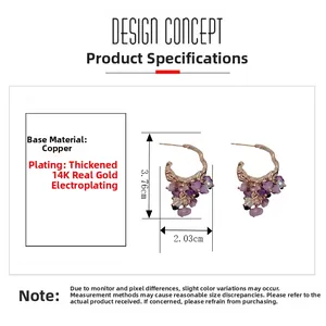 Macro view of C-shaped 14K gold plated earrings featuring purple natural stone beads