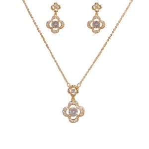 Luxury gold four-leaf clover jewelry set featuring sparkling zircon necklace and earrings