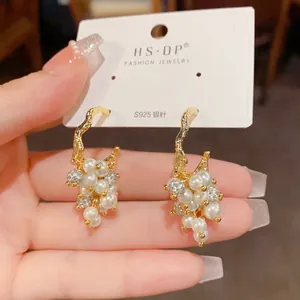 Detailed view of grape cluster earrings with pearls and S925 silver needle posts