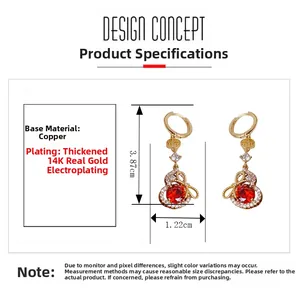 Détail des boucles d'oreilles plaquées or 14K avec pierres rouges et dimensions 3,87x1,22cm