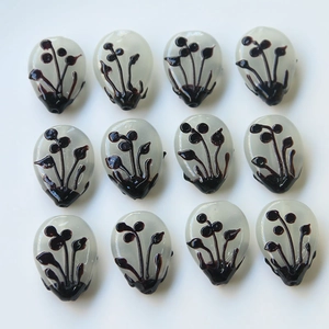 Set of 12 teardrop glass beads with brown floral ink patterns for DIY jewelry making