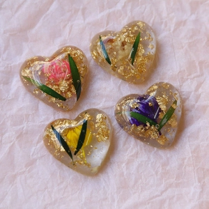 Handmade clear heart resin pendants with dried flowers and gold foil accents