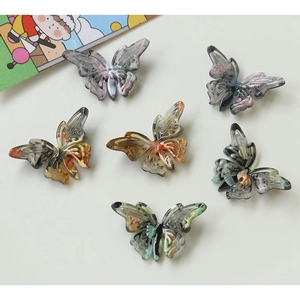 Set of six vintage butterfly acetate DIY accessories with marble textures in pastel colors