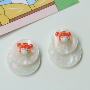 Acrylic round earrings with 3D cartoon girl figure blowing bubbles on white resin base