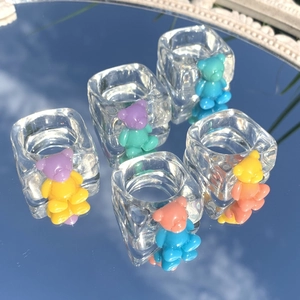 Five pieces of transparent resin bear rings featuring colorful Y2K gradient designs