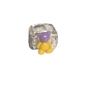 Chunky transparent resin ring featuring a cute purple and yellow gradient cartoon bear