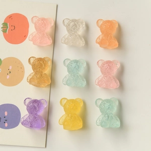 Macro shot of 3D resin gummy bears with frosted texture in pastel colors for DIY crafts