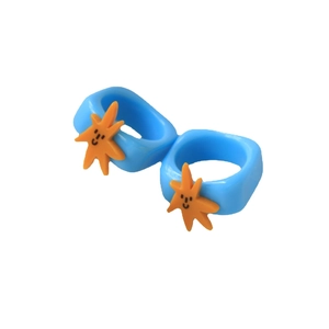 Chunky blue resin ring set with orange smiling sun charm in dopamine style jewelry
