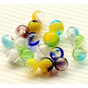 Macro shot of 16mm gradient striped glass beads with holes for DIY jewelry making