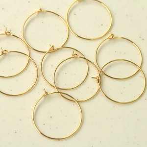 Macro shot of 30mm gold plated geometric circular hoop earrings for DIY jewelry making