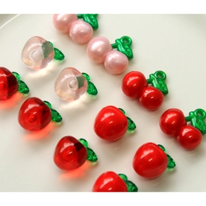 Assorted DIY acrylic fruit beads featuring red cherries and pink apples for jewelry