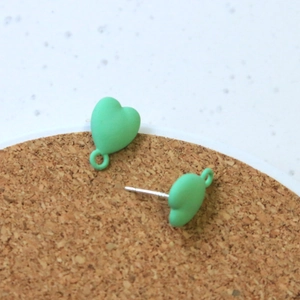 Detail of mint green heart stud earrings with dangling loops for DIY jewelry making