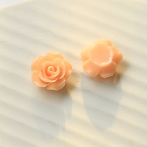 Detailed view showing both front and flat back of peach resin rose DIY craft accessories