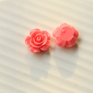 Macro view of peach pink resin rose flower charms with flat back for DIY jewelry making