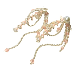 French vintage tassel hair accessory with pearls and crystal beads on white background