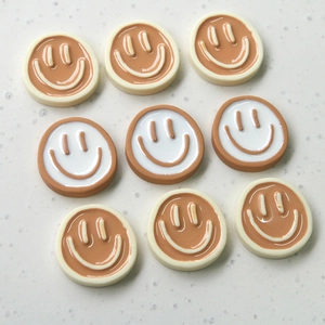 Flat round resin smile charms in cream and coffee tones for DIY jewelry making and crafts