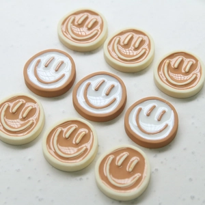 Cute DIY resin smiley face charms in cream and brown for jewelry and phone case making