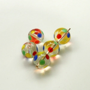 Five transparent glass beads with colorful rainbow polka dots for DIY jewelry making