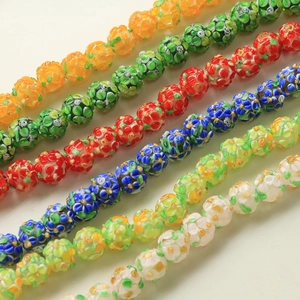 Macro shot of colorful millefiori glass beads with detailed flower patterns for DIY jewelry