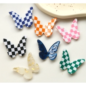DIY colorful resin butterfly charms with checkerboard and marble patterns for accessories