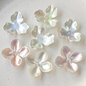 Detailed macro view of colorful iridescent clover flower beads for DIY jewelry making