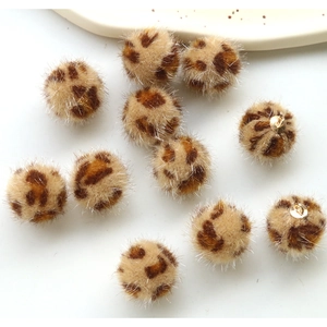 Leopard print plush pom-pom charms with gold loops for DIY jewelry and accessory making