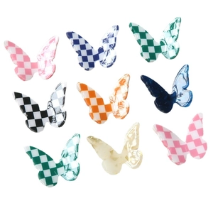 Colorful resin butterfly accessories with checkerboard and marble patterns for DIY crafts