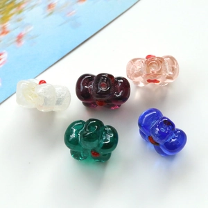 Colorful glass bow beads for DIY jewelry making in various transparent shades