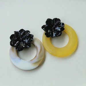 Dark floral resin earrings with marble and yellow rings in high gloss finish