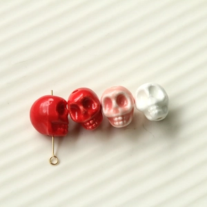 Detail of colorful skull-shaped resin beads for DIY jewelry making and crafts