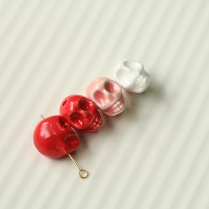 Detailed view of colorful ceramic skull beads with glossy finish for DIY jewelry crafts