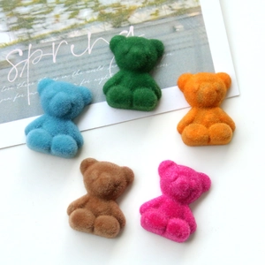 Detail shot of five colorful flocked mini bears for DIY jewelry and accessories