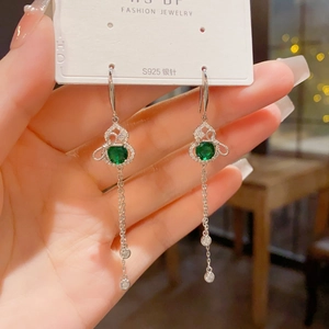 Detail of S925 silver needle gourd earrings with green gems and long zircon tassels