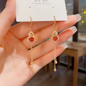 Exquisite gold gourd tassel earrings with sparkling red gemstone and hanging chains