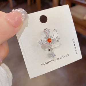 Exquisite cross brooch with orange crystal and teardrop zircons in silver finish