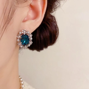 Vintage silver petal earrings with deep blue oval gemstone and white pearls