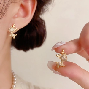 Sparkling gold reindeer stud earrings with pavé crystals for a festive minimalist look