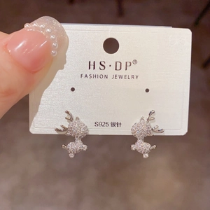 Macro view of S925 silver elk stud earrings featuring full pavé white zircon stones