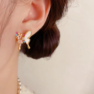 Elegant gold butterfly stud earrings with shell inlay and colorful cubic zirconia gems