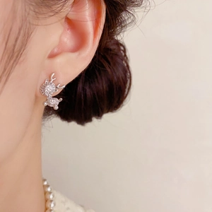 Sparkling crystal reindeer stud earrings in silver-tone metal for a festive holiday style