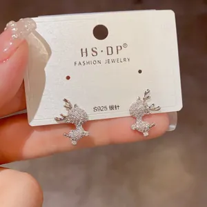 Detail of S925 silver stud earrings featuring a reindeer design with sparkling cubic zirconia