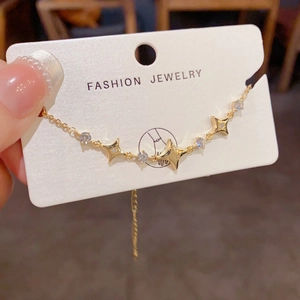 Elegant gold star bracelet with inlaid crystals and adjustable chain for women
