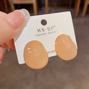 Detailed view of pink enamel oval stud earrings with gold plating and S925 silver pins