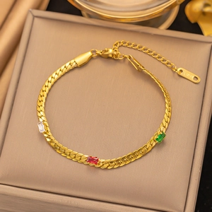 Detailed view of gold plated chain bracelet with tricolor gemstone accents and 18KGP tag