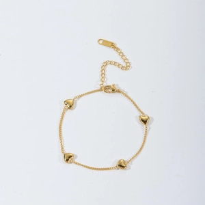 Gold stainless steel heart bracelet with four 3D charms and adjustable lobster clasp