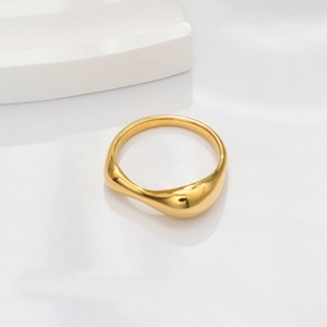 Minimalist 18k gold wavy irregular stainless steel ring on white geometric display