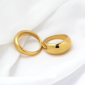 Polished 18k gold plated minimalist wide band and thick dome ring set on white fabric