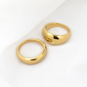 Minimalist 18k gold plated dome and slim ring set on elegant white silk background