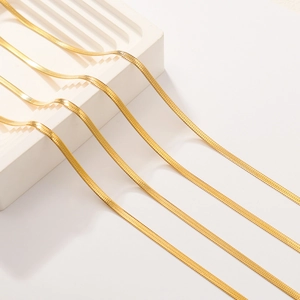 Detailed view of 18K gold plated stainless steel snake bone necklaces with mirror finish